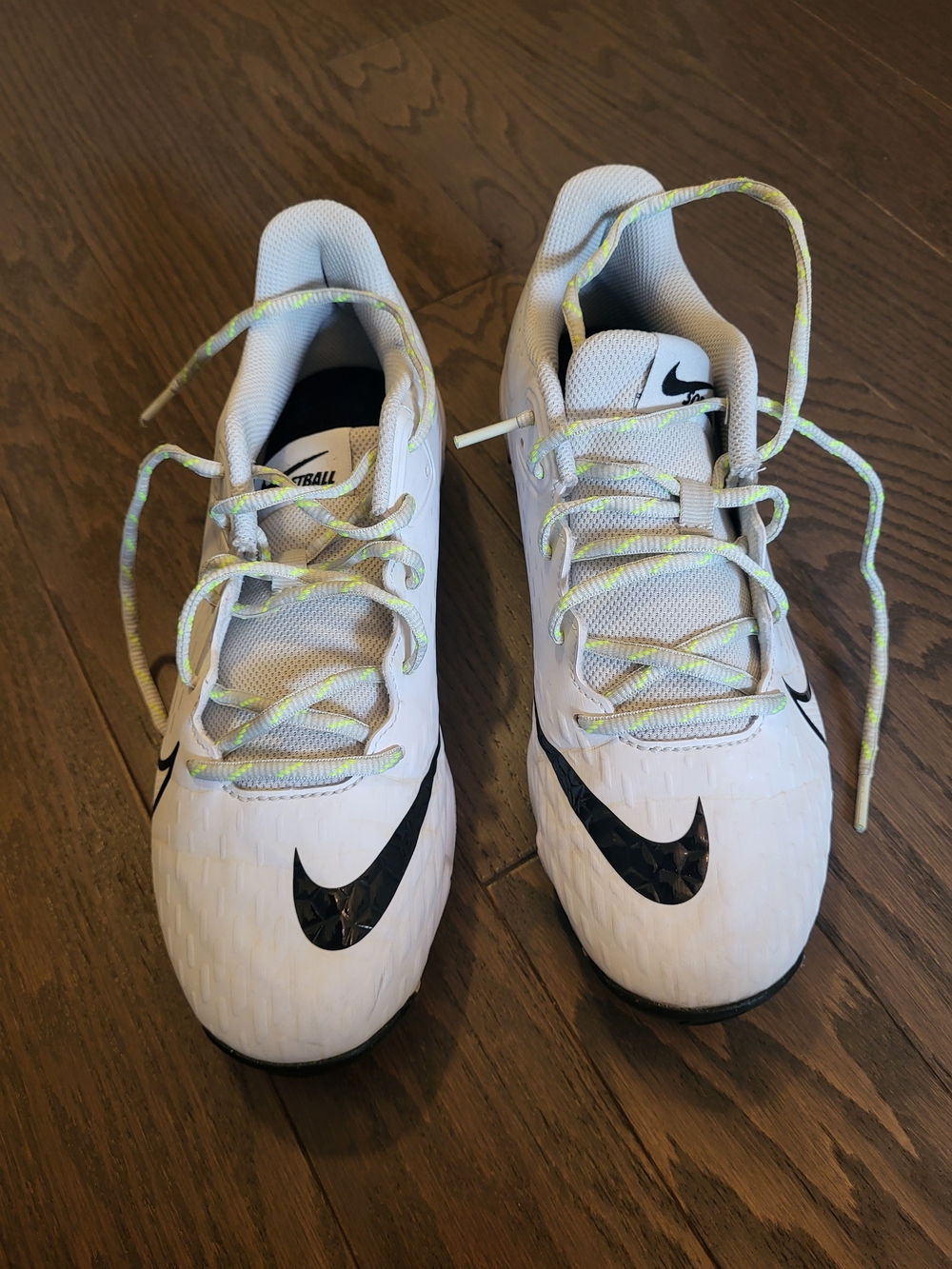 Nike Women White Cleats with Black Swoosh and Neon-Pattern Laces